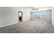 Carpeted bedroom with three windows for plenty of natural light at 14050 Arbor Pines Dr, Riverview, FL 33579