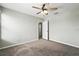 Bedroom featuring neutral carpet and a ceiling fan; doorway visible to other rooms at 14050 Arbor Pines Dr, Riverview, FL 33579
