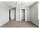 Bedroom featuring neutral carpet, ceiling fan, and closet with double doors at 14050 Arbor Pines Dr, Riverview, FL 33579