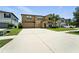 Charming two-story home featuring a two-car garage, landscaped yard, and welcoming front entrance at 14050 Arbor Pines Dr, Riverview, FL 33579