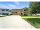 Charming two-story home featuring a two-car garage, landscaped yard, and welcoming front entrance at 14050 Arbor Pines Dr, Riverview, FL 33579