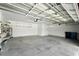 Spacious garage with storage racks and lighting at 14050 Arbor Pines Dr, Riverview, FL 33579