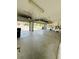 Spacious garage with overhead storage racks and a lot of room for cars at 14050 Arbor Pines Dr, Riverview, FL 33579