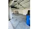 Spacious garage with overhead storage racks and plenty of space for vehicles at 14050 Arbor Pines Dr, Riverview, FL 33579