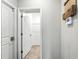 Hallway showcasing an open door to the walk-in closet at 14050 Arbor Pines Dr, Riverview, FL 33579