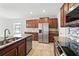 Kitchen with granite countertops and stainless steel appliances at 14050 Arbor Pines Dr, Riverview, FL 33579
