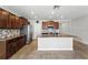 Open kitchen featuring granite countertops, stainless steel appliances, mosaic tile backsplash, and a center island at 14050 Arbor Pines Dr, Riverview, FL 33579