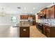 Kitchen island with stainless steel appliances and tile backsplash at 14050 Arbor Pines Dr, Riverview, FL 33579