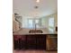 Open concept kitchen with granite island and stainless steel dishwasher with an open view to living room at 14050 Arbor Pines Dr, Riverview, FL 33579