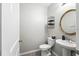 Functional powder room with a pedestal sink, tiled floors and neutral walls at 14050 Arbor Pines Dr, Riverview, FL 33579