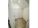 Walk-in closet with built-in wire shelving and tiled floor at 14050 Arbor Pines Dr, Riverview, FL 33579