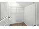Empty walk-in closet with wire shelving and tile flooring at 14050 Arbor Pines Dr, Riverview, FL 33579