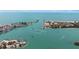 Scenic coastal view of a sandy beach, turquoise waters, and boats sailing along a scenic waterway at 1423 Venetia St, Nokomis, FL 34275