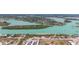 Beautiful waterfront view with boats sailing along the aqua blue water on a sunny day at 1423 Venetia St, Nokomis, FL 34275