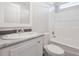 Bright bathroom featuring a sleek vanity with a marble countertop and a combined shower and tub at 1423 Venetia St, Nokomis, FL 34275