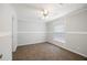 This bright bedroom features neutral carpet, a ceiling fan, and a window at 1423 Venetia St, Nokomis, FL 34275