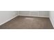 This bedroom features a neutral carpet, a white baseboard, and fresh paint at 1423 Venetia St, Nokomis, FL 34275