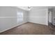Bright bedroom featuring a ceiling fan, window, and plush carpet flooring at 1423 Venetia St, Nokomis, FL 34275