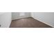 Comfortable bedroom featuring neutral carpet, white baseboards, and a bright window at 1423 Venetia St, Nokomis, FL 34275