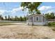 Well-maintained single-story home featuring a spacious front yard and covered porch at 1423 Venetia St, Nokomis, FL 34275