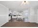 Open floor plan with a modern kitchen with stainless steel appliances and island at 1423 Venetia St, Nokomis, FL 34275