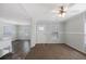 Spacious living room featuring carpet and abundant natural light at 1423 Venetia St, Nokomis, FL 34275