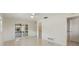 Bright bedroom with polished floors and sliding glass doors leading to covered patio at 1531 Picardy Cir, Clearwater, FL 33755