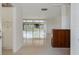 Bright living room with plenty of natural light and a view to a screened patio at 1531 Picardy Cir, Clearwater, FL 33755