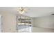 A well-lit living room with sliding glass doors leading to an outdoor patio at 1531 Picardy Cir, Clearwater, FL 33755