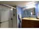 Cozy bathroom featuring a shower with glass door and a well-lit vanity at 1710 7Th Sw St # 24, Ruskin, FL 33570