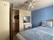 Comfortable bedroom with blue accent wall, mirror, and decorative quilt at 1710 7Th Sw St # 24, Ruskin, FL 33570