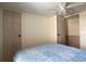 Neutral bedroom featuring closet and blue quilt bedding at 1710 7Th Sw St # 24, Ruskin, FL 33570