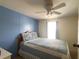 Bedroom boasts a queen-sized bed, bright window, and coastal-inspired decor at 1710 7Th Sw St # 24, Ruskin, FL 33570