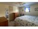 Comfortable bedroom with large bed, wood dresser, and bright natural light at 1710 7Th Sw St # 24, Ruskin, FL 33570