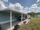 Single-Gathering home with carport, nice landscaping, and a well-maintained lawn on a sunny day at 1710 7Th Sw St # 24, Ruskin, FL 33570