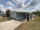 Charming home with a long carport, garden bed and well-kept exterior at 1710 7Th Sw St # 24, Ruskin, FL 33570