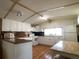 Bright kitchen featuring white cabinets, laminate countertops, and a light wood floor and table with a butcher block top at 1710 7Th Sw St # 24, Ruskin, FL 33570