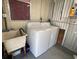 This laundry room features a washer, dryer and wash tub for your convenience at 1710 7Th Sw St # 24, Ruskin, FL 33570