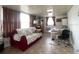 Well-lit sunroom/living area with a comfortable sofa and workspace, offering versatile usage at 1710 7Th Sw St # 24, Ruskin, FL 33570