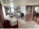 Sunroom that doubles as a living area, with a sofa and a desk for working at 1710 7Th Sw St # 24, Ruskin, FL 33570