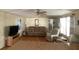 Cozy living room featuring a plush sofa, recliner, and wood-paneled walls at 1710 7Th Sw St # 24, Ruskin, FL 33570