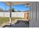 Open backyard with a white privacy fence and a partially covered patio area at 1764 St Croix Dr, Clearwater, FL 33759