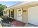 Close up view of the exterior, entry door and front yard at 1764 St Croix Dr, Clearwater, FL 33759