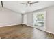 Inviting living room featuring a ceiling fan, laminate flooring, and a bright window at 1764 St Croix Dr, Clearwater, FL 33759