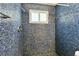 Bright mosaic tile shower featuring two shower heads and a window at 1764 St Croix Dr, Clearwater, FL 33759