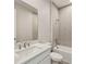 Contemporary bathroom with a white vanity, shower/tub and tiled walls at 17800 Solstice Ave, Venice, FL 34293