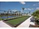 Bocce ball court with benches situated near the tennis courts, great for a relaxing game at 17800 Solstice Ave, Venice, FL 34293