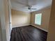 Bright bedroom with neutral walls, wood floors, and a ceiling fan at 18267 Bridle Club Dr, Tampa, FL 33647