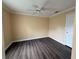 Neutral bedroom showcasing hardwood floors and a ceiling fan at 18267 Bridle Club Dr, Tampa, FL 33647