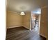 Open dining area with hardwood floors, view into the kitchen with stainless steel appliances at 18267 Bridle Club Dr, Tampa, FL 33647